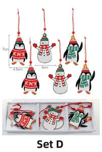 Detail of 6-piece wooden Christmas pendants Set D featuring snowman and penguin motifs