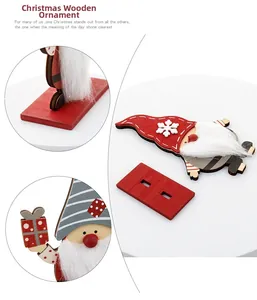 Close-up of wooden Christmas gnome ornament showing the base assembly and snowflake detail