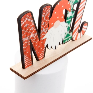 Wooden NOEL Christmas desk ornament with gnome design and festive patterns on white stand