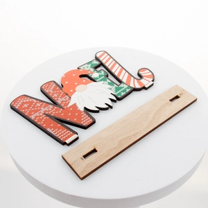 Christmas wooden NOEL table ornament with festive gnome figures and a stable base