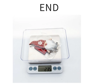 Close-up of a 23.5g Christmas gnome figurine on a digital scale for weight display