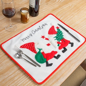 Christmas forest gnome dining placemat with white embroidery and Merry Christmas text