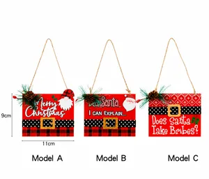Detail of wooden Christmas ornaments with festive patterns, pine cones and berries