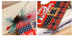 Detail of wooden Merry Christmas sign with pine cones, berries and buffalo plaid patterns