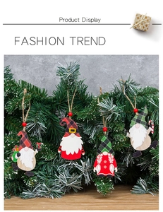 Detail of wooden Christmas gnome ornaments with red-green plaid hats and rustic jute ropes