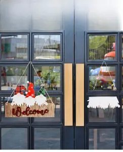 Detail of Christmas wooden Welcome sign featuring three gnomes and festive red plaid textures