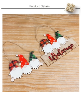 Detail of wooden Christmas gnome signs with Welcome text and rustic jute hanging ropes