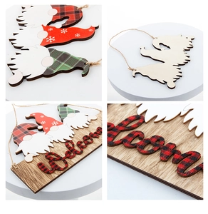 Detail of wooden Christmas Welcome sign with gnome pendants and festive plaid patterns