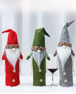 Three-piece Christmas gnome wine bottle covers in red, green, and gray felt with wood buttons