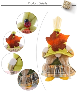 Detail view of harvest gnome showing ladybird, maple leaf, hand and plaid skirt features