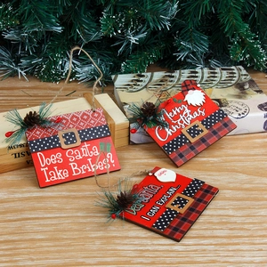 Three festive wooden Christmas ornaments with red and black buffalo plaid and pine cones