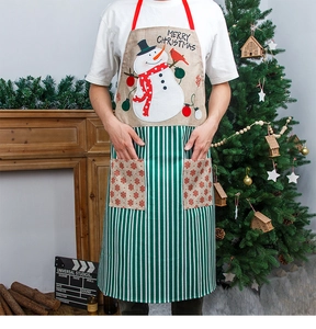 Detail of Christmas apron with snowman print, striped bottom and dual pockets