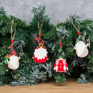 Set of 4 Christmas wooden gnome ornaments with plaid hats hanging on pine branches