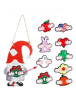 Detail view of DIY wooden gnome door sign with nine seasonal interchangeable holiday icons