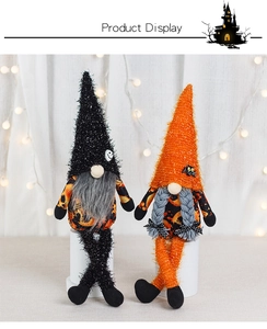 Detail of plush Halloween gnomes with long legs featuring bat and skeleton hat decorations