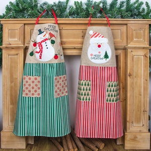 Christmas snowman and Santa aprons with red and green stripes for festive kitchen decor