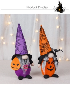 Detail of Halloween gnome plush dolls with spider web hats and pumpkin themed decorations