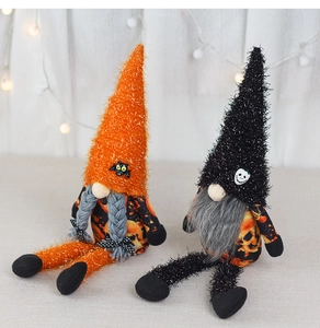 Detail of Halloween gnomes with sequined hats and bat skull accents on a cozy background