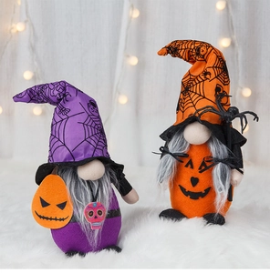 Detail view of plush Halloween gnomes with spider webs and skull patterns for decor