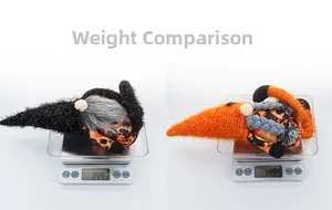 Weight test showing two Halloween gnomes at approximately 144g and 150g on a digital scale