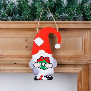 DIY Christmas gnome wooden welcome sign with hanging wreath and red holiday hat décor
