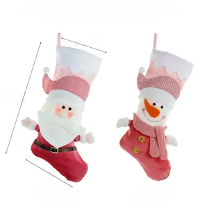 Pink Christmas stockings with Santa and Snowman plush details and size dimensions