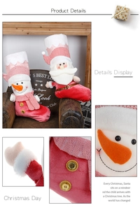 Detailed view of pink Christmas stockings featuring knit texture and 3D plush characters