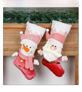 Detailed close-up of 3D Santa and Snowman plush Christmas stockings on fireplace