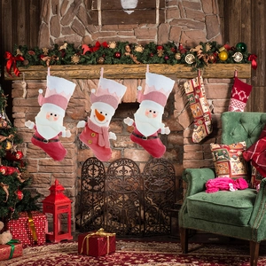 Pink 3D cartoon Christmas stockings with Santa and Snowman in a cozy fireplace setting