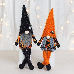 Halloween long-legged faceless gnome plush dolls with pumpkin patterns on a white pedestal