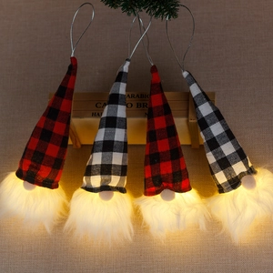 Set of four lighted Christmas gnomes with red and white plaid hats and glowing beards