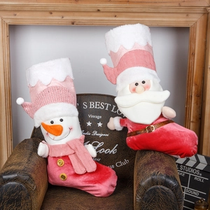 Pink Christmas stockings with 3D Santa and Snowman figures for holiday gift packaging
