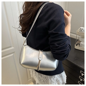 Silver metallic PU leather underarm bag featuring a minimalist metal bar closure and strap