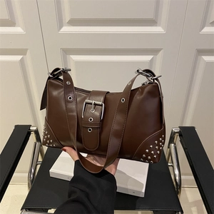 Vintage dark brown studded tote bag with silver buckle and eyelet strap for women