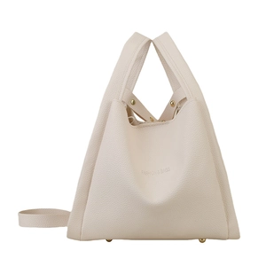 Chic beige lychee grain bucket bag with top handle and gold studs shown on white background