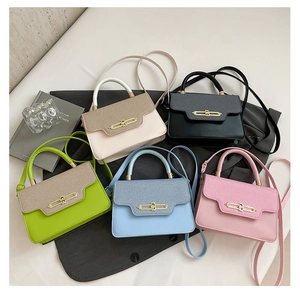 Detail shot of five elegant PU leather crossbody bags in various colors with gold metal buckles