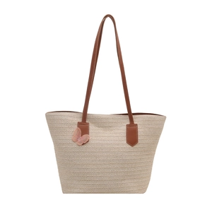 Summer straw tote bag with brown leather straps and pink butterfly embroidery detail