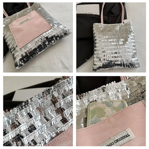 Detail of silver sequin tote bag with pink pocket and spacious interior for smartphone