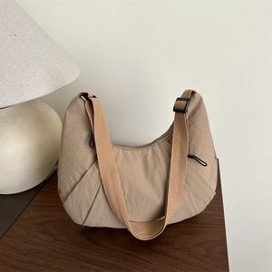 Minimalist large khaki hobo tote bag in water-resistant nylon with adjustable strap