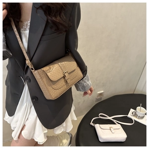 Detail showing crocodile texture on French vintage PU leather shoulder bag with buckle