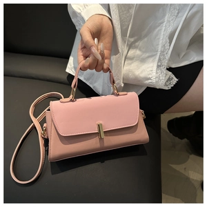 Detail of pink patchwork crossbody bag with premium PU texture and gold metal buckle