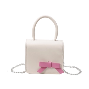 Mini cream leather crossbody bag for girls with pink bow detail and silver chain strap