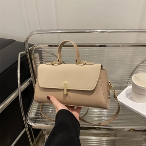 Chic beige and apricot leather shoulder bag with gold clasp and detachable strap
