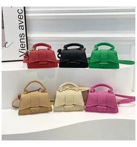 Detailed arrangement of mini woven handbags in six colors with textured strap detail