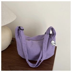 Purple corduroy hobo bag with adjustable strap and cute cartoon puppy pendant