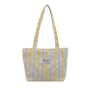 Large striped canvas tote bag with yellow and purple stripes for women's daily commute