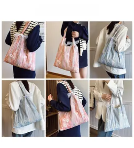 Detailed views of floral lace mesh tote bag with 3D embroidery and lace bow strap
