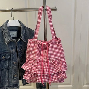 Pink and white checkered tote bag with tiered ruffles and drawstring closure
