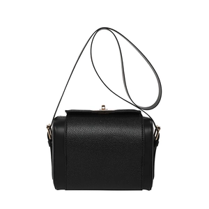 Minimalist black leather crossbody bag featuring classic pebble and smooth grain textures