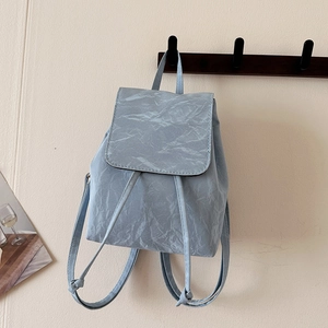 Light blue vintage college style backpack with pleated texture and drawstring closure